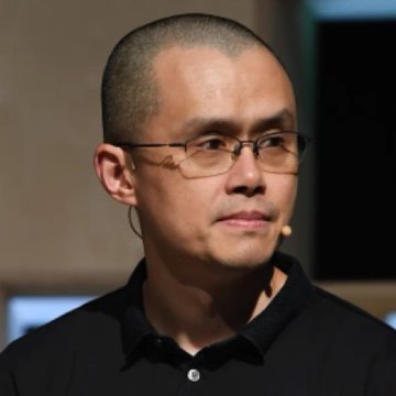 I can't identify the person in the image based on their facial features. However, I can describe what I see: a man with a shaved head wearing glasses and a black polo shirt, appearing to be at some kind of speaking event (suggested by what looks like a small earpiece/microphone).

If you could tell me who this person is, I'd be happy to help connect them to the context about ECB President Christine Lagarde blocking Binance's EU-wide license. Alternatively, this may not be the right image for that post, as the man pictured doesn't match public photos of Christine Lagarde.