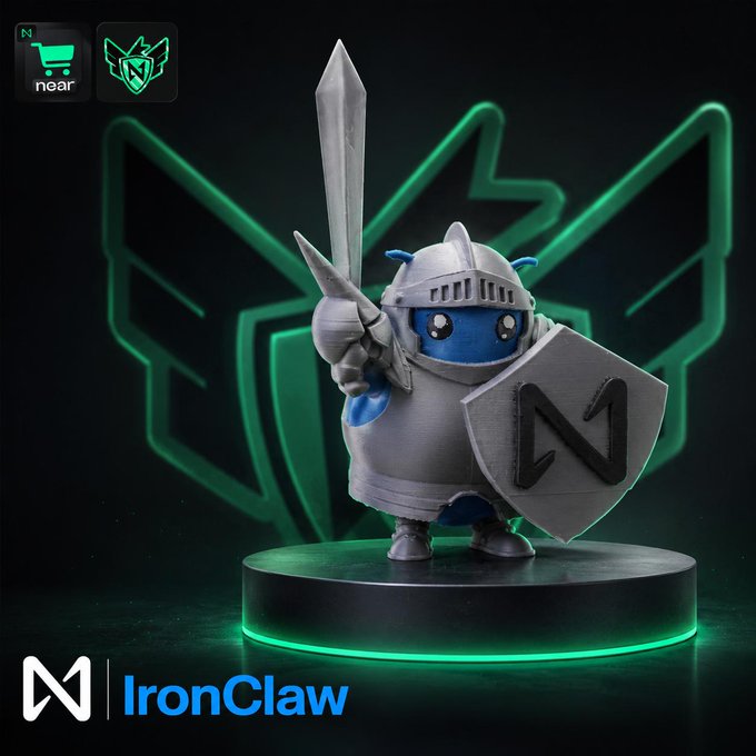 The image features a small figurine of IronClaw, a character from the video game Minecraft, standing on a black platform with a sword in its hand. The figurine has blue eyes and a blue shield that says "N1" on it. The background is dark green, which complements the color scheme of the figurine. The post mentions an agent named IronClaw who protects keys, data, and intents within the agent economy.