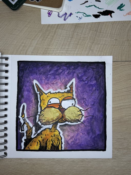 A sketchbook page with a drawing of a yellow cat with wide eyes against a purple watercolor background.
