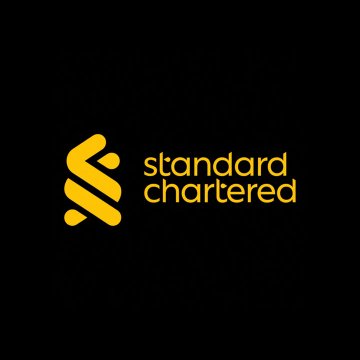 The image features a black background with a vibrant yellow logo for Standard Chartered. The logo has two distinct shapes within it - one resembling a snake and the other resembling a bird. These shapes are outlined in black against the yellow, creating a striking contrast. Below the logo, there is text that reads "Standard Chartered". This text seems to be in a smaller font size than the logo itself. Overall, the image showcases the Standard Chartered logo alongside accompanying text on a dark background.