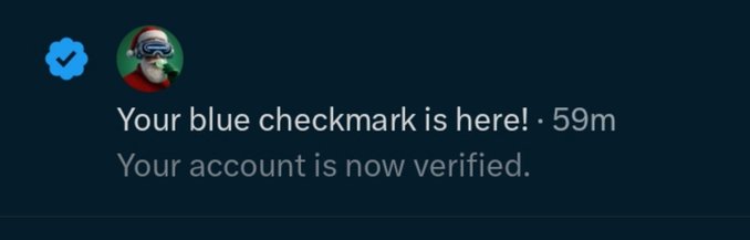 A social media notification on a dark background reading 'Your blue checkmark is here! · 59m' and 'Your account is now verified,' featuring an avatar of a dog in goggles.