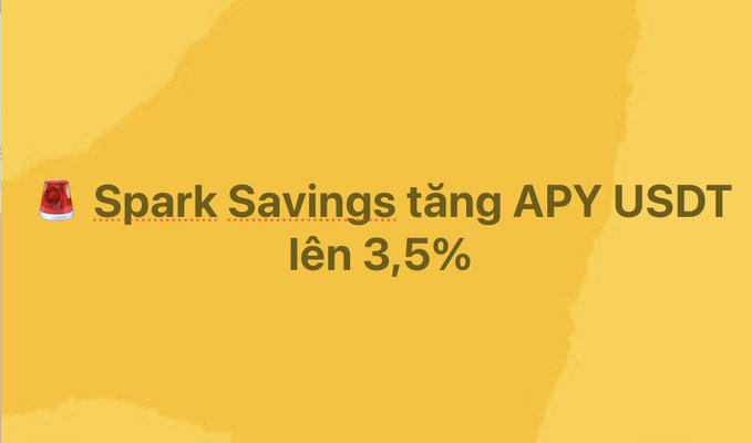 A simple yellow graphic with a small red gem icon and the text '🥩 Spark Savings tăng APY USDT lên 3,5%' announcing an interest rate increase.