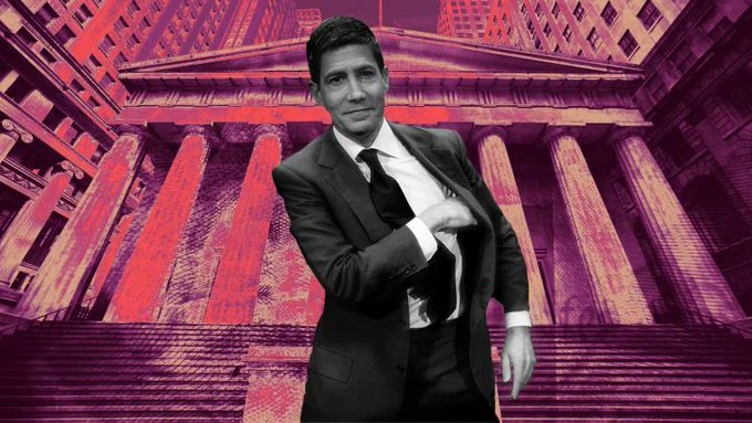 The image shows a man dressed in a suit standing in front of an old building, giving off a professional appearance. In the background, there are columns which could be part of a courthouse or a historical site with a purple tint that gives it a unique color scheme. The photo is captioned "The math: BTC sitting at BTC = $64,715; Warsh's first FOMC call tomorrow and inflation still near a 3-year high. Fed holds rates." This suggests an analysis of the stock market or cryptocurrency trends as per the image.