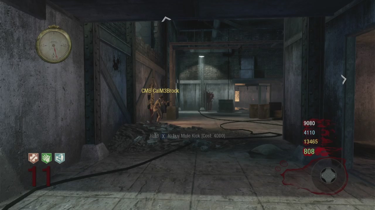 The image shows a group of people playing a video game, with one person holding a gun. The players are engaged in an action-packed game that involves using a sword for combat. A clock can be seen hanging on the wall behind them, indicating the time while they play.