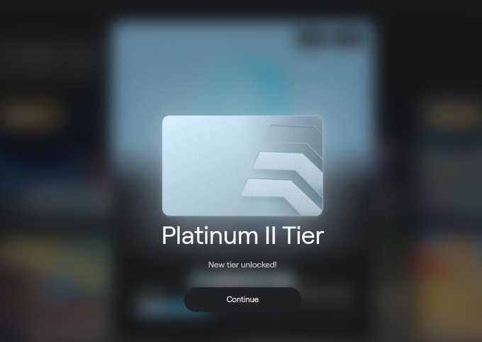 A mobile app pop-up notification celebrates 'Platinum II Tier' with a 'New tier unlocked!' message and a 'Continue' button over a blurred background.