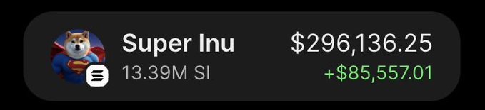 A trading app screenshot displays the meme coin "Super Inu" ($SI) with a current value of $296,136.25, showing a holdings amount of 13.39M SI and a notable gain of +$85,557.01 in green, illustrating the post's claim of profiting nearly $300,000 from the token.
