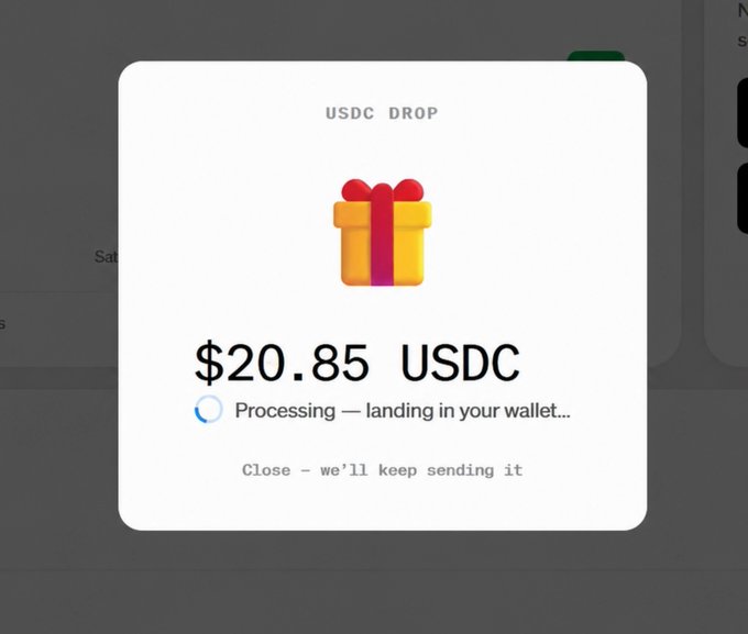 A pop-up window for a 'USDC DROP' showing a gift box icon and a payout of $20.85 USDC being processed to land in the user's wallet.