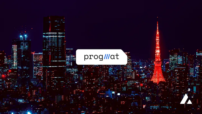 The image shows a city skyline at night with a tall tower that has a red light on top. The text "progmat" appears multiple times throughout the image, possibly indicating an advertisement or promotional material for a cryptocurrency exchange platform called Progmat.