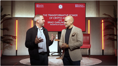 Two men in business attire stand on stage in front of a backdrop reading "THE TRANSFORMATION POWER OF BRANDS & BUSINESS" with "BRAD Garlinghouse" displayed, with the image accompanying a post promoting XRP's role in enabling fast, cheap cross-border payments through blockchain technology used by major global banks.