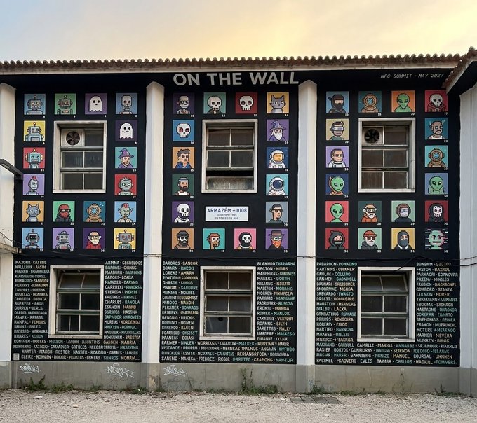 A mural titled 'ON THE WALL' with 'NFC SUMMIT - MAY 2023' and 'ARMAZEN - 0101' features pixel-art portraits of various characters along with extensive lists of names below each section.