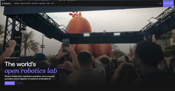 A screenshot of the Instill website showing a crowd gathered under a metal structure around a large pink sculpture, with the text 'The world's open robotics lab' and 'Where researchers, hardware operators, and compute providers come together to advance embodied AI'.