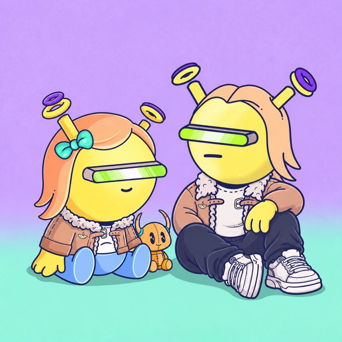 A cartoon illustration of two cute robot-like characters with TV-shaped heads and antenna, sitting on the ground against a purple and teal background, accompanied by a small orange dog-like figure.