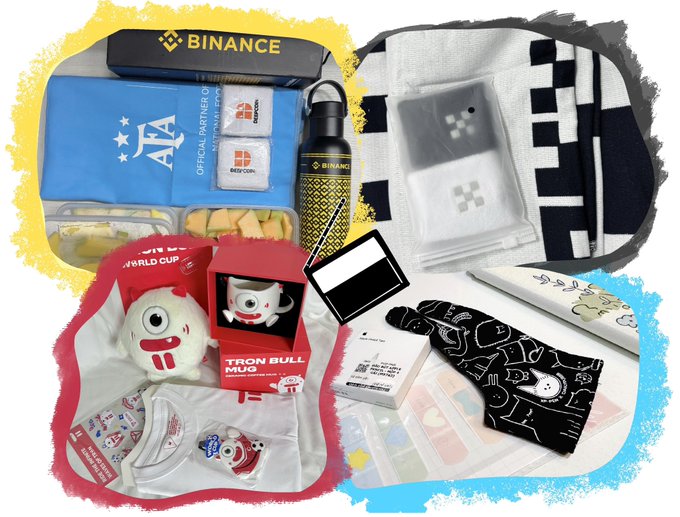 A collection of Binance-branded merchandise and promotional items, including an AFA (Argentine Football Association) partner box, Binance water bottle, World Cup 'Tron Bull Mug', socks, a shirt, and various other crypto-themed accessories.