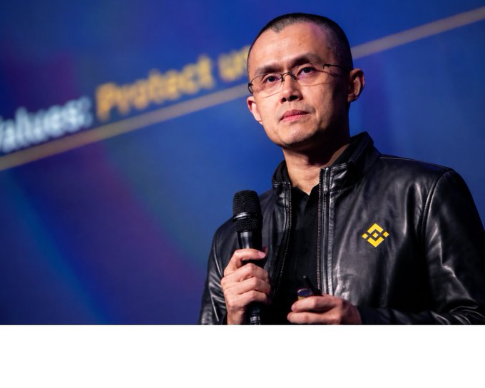 A man identified as CZ, wearing a black leather jacket with the Binance logo, speaks into a microphone. The image relates to the post by visually representing Binance, the platform whose ecosystem is being discussed in relation to crypto events and tokens like $MARSCOIN.
