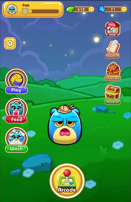 A screenshot of the PALZ mobile game interface featuring a sad blue bear character named "Palz" (level 10) with 612 gems and 71 energy, alongside interactive buttons for Play, Feed, Wash, Shop, Quest, Inventory, Rewards, and Arcade functions, illustrating the ONTO Wallet DApp browser game accessible at play.palzgame.com.