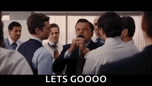 The image shows a group of men standing around each other, with one man holding a microphone and singing into it. There are at least six people visible in the scene, including two men wearing ties. The text "Let's gooo" is written on the image, which appears to be part of a larger post or caption that includes the image.