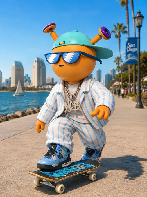 A 3D-rendered cartoon character wearing a teal cap with antennae, blue sunglasses, a light blue and white striped outfit, and blue sneakers, standing on a skateboard on a San Diego waterfront promenade with the city skyline in the background.
