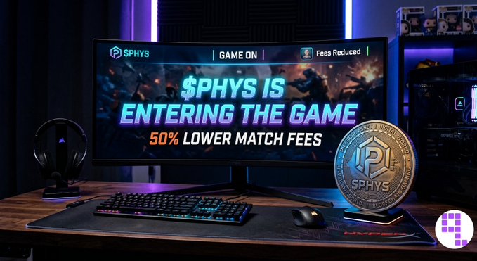 A gaming setup promotional image showing a monitor displaying '$PHYS IS ENTERING THE GAME' with '50% LOWER MATCH FEES', accompanied by a keyboard, mouse, headset, and a large $PHYS cryptocurrency coin on a desk.