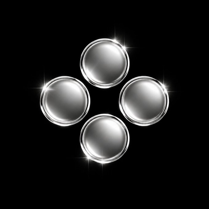 Four shiny silver metallic spheres arranged in a diamond pattern against a black background with bright light reflections.