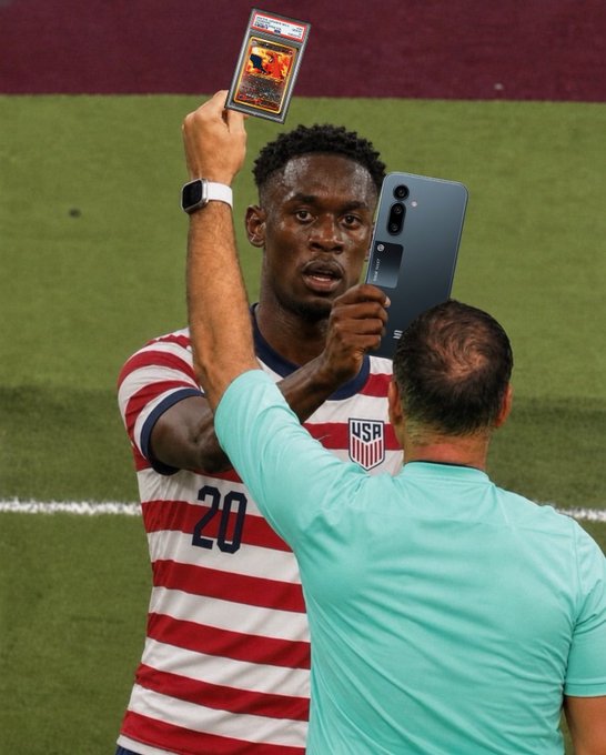 A USA soccer player wearing jersey number 20 holds up a PSA-graded trading card slab while taking a selfie with another person on the field, fitting the post's excitement about seeking rare trading card slabs.