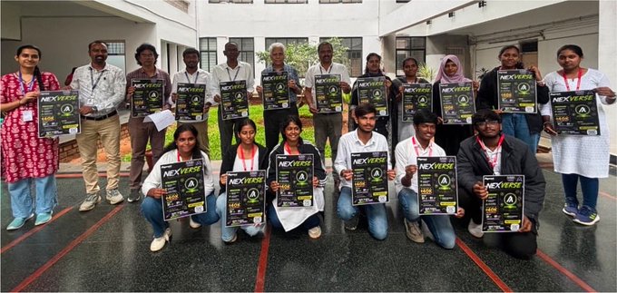 A group of people pose together indoors holding up copies of 'NEXTERS' magazine, wearing white lab coats and lanyards, suggesting a student or staff gathering.