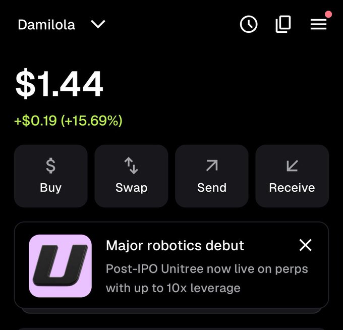 A mobile app screenshot shows a balance of '$1.44' with a gain of '+$0.19 (+15.69%)' for user 'Damilola', featuring Buy, Swap, Send, and Receive buttons and an ad for 'Major robotics debut' involving 'Post-IPO Unitree'.