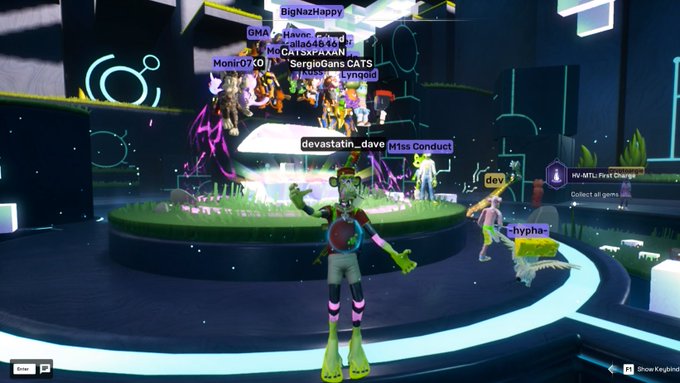 A vibrant video game scene shows multiple avatars gathered on a circular platform, including a green character in the foreground, with player names like 'BigNazHappy', 'SergioGans CATS', and 'M1ss Conduct' floating above them.