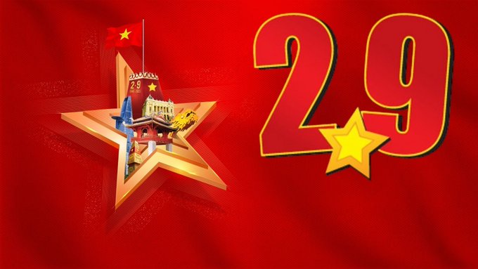 A red graphic with the number '29' displayed in large yellow and red outlined text, alongside a gold star containing the Chinese flag and illustrations of landmarks, likely commemorating a Chinese national celebration.