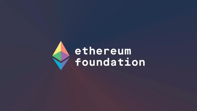 Etherium Foundation logo, featuring a blue triangle with a rainbow gradient and the words "Etherium" and "Foundation" below it.