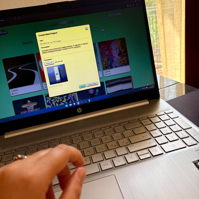 A person's hand rests on the keyboard of an HP laptop displaying a 'Create New Project' modal titled 'OrdinaryThings' over a green interface background.