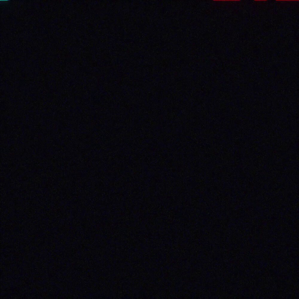The image shows a black square, which appears to be a screen or a window. The background color is dark, creating a stark contrast with the white text that reads "We're giving away 3x GTD WL for @wherelumi Follow @MansChads & @Cryptoorro! RT & !". The image also contains some text in another language and a logo at the bottom right corner.