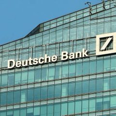 The Deutsche Bank logo and name displayed on a modern glass skyscraper.