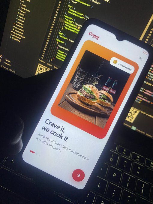 A smartphone displays the 'Crave' food app onboarding screen featuring the tagline 'Crave it, we cook it' and a photo of sliders labeled 'Fresh today.'