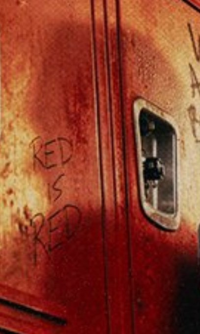 Close-up of a red surface with graffiti reading "RED IS RED" and the hashtag #USABEL. This image likely reflects the color red in abstract or literal interpretations, tying into the post's theme or brand "USABEL."