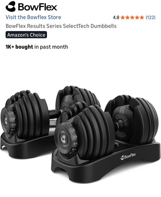 Two black Bowflex dumbbells, each with a silver weight plate and a black handle, are displayed on a black stand against a white background.