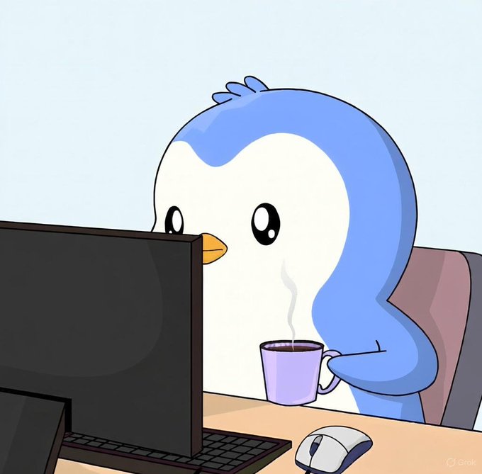 A cartoon illustration of a blue and white penguin-like character sitting at a desk in front of a computer monitor, holding a steaming purple mug.