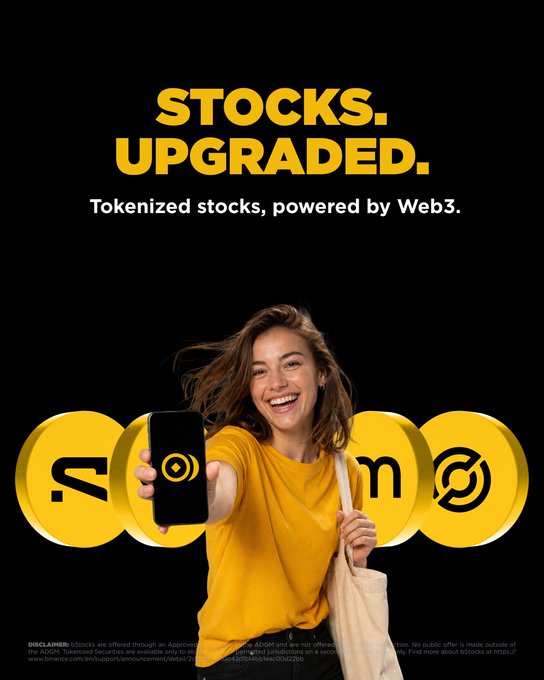 A smiling young woman in a yellow shirt holds out a smartphone displaying a target-like logo, standing against a black background with large yellow coins bearing the Binance, M, and another logo, while bold yellow text above reads "STOCKS. UPGRADED." and white text states "Tokenized stocks, powered by Web3."—visually reinforcing the post's message about bStocks bringing tokenized, 24/7 trading to traditional equities through Web3 technology.