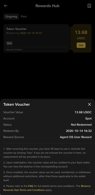 A mobile screenshot of a 'Rewards Hub' interface showing a Token Voucher worth 13.68 USDC from an 'Agent OS User Reward' source, redeemable by 2026-10-14, with detailed terms and conditions listed below.
