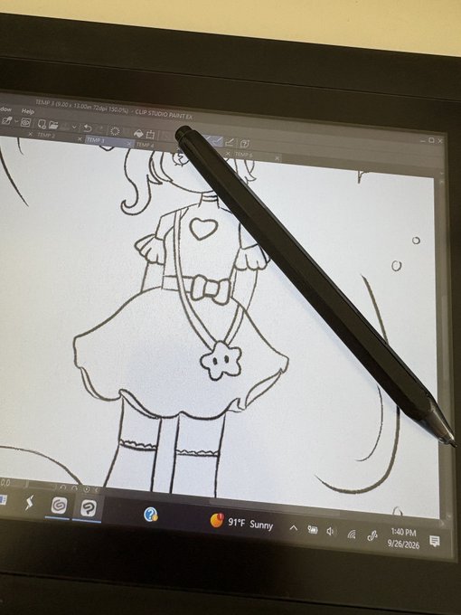 A black Wacom pen rests diagonally on a drawing tablet screen showing a line art illustration of a girl in a frilly dress. The Windows taskbar at the bottom shows the date 9/26/2025, time 1:40 PM, and weather as 91°F Sunny.
