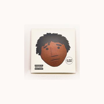 The image shows a CD/album cover featuring a stylized illustrated face with box braids and a mustache on a cream background, with "Ed-ible Album" text on the right side and a parental advisory label at the bottom, aligning with the post's promotion of an "Ed-ible" album.