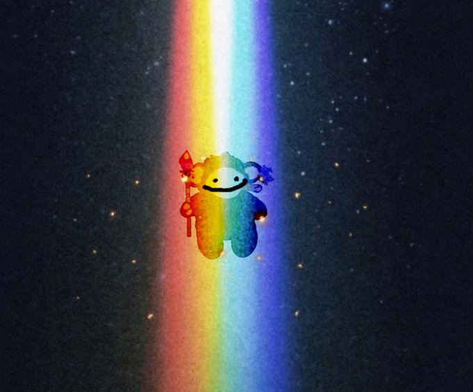 A cute, colorful illustration of a smiling, furry cartoon monster bathed in a vertical beam of rainbow light against a dark, starry background.