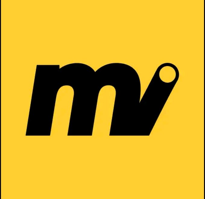 The image features a yellow square with black text that reads "m@i@v" written in all capital letters. The background of the image is white, which makes the black text stand out prominently. There are no other objects or elements present in the image besides the yellow square and the black text.