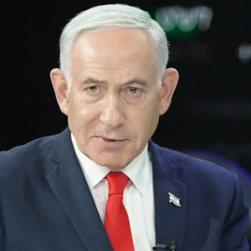 A close-up portrait shows Benjamin Netanyahu in a dark suit, white shirt, and red tie, with an Israeli flag lapel pin.