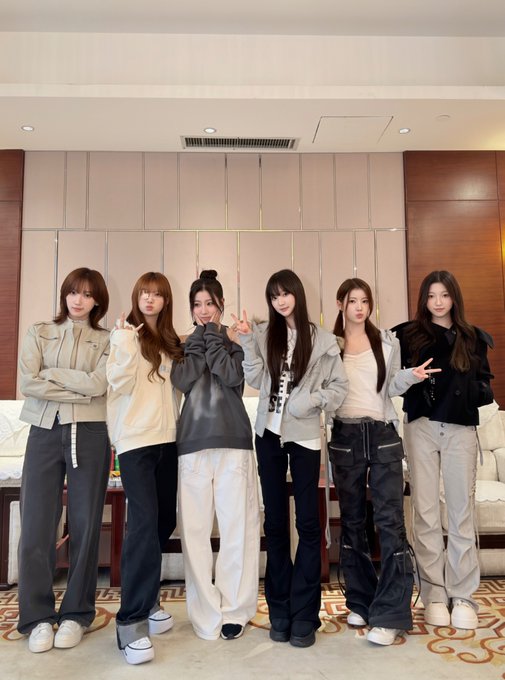 Six members of the group USPEER pose together in casual streetwear for their "XINGDAO PROMOTION DAY" event, as indicated by the accompanying post referencing #USPEER_DAY and their track "WICKEDGAME" from the BITE DISTRICT.