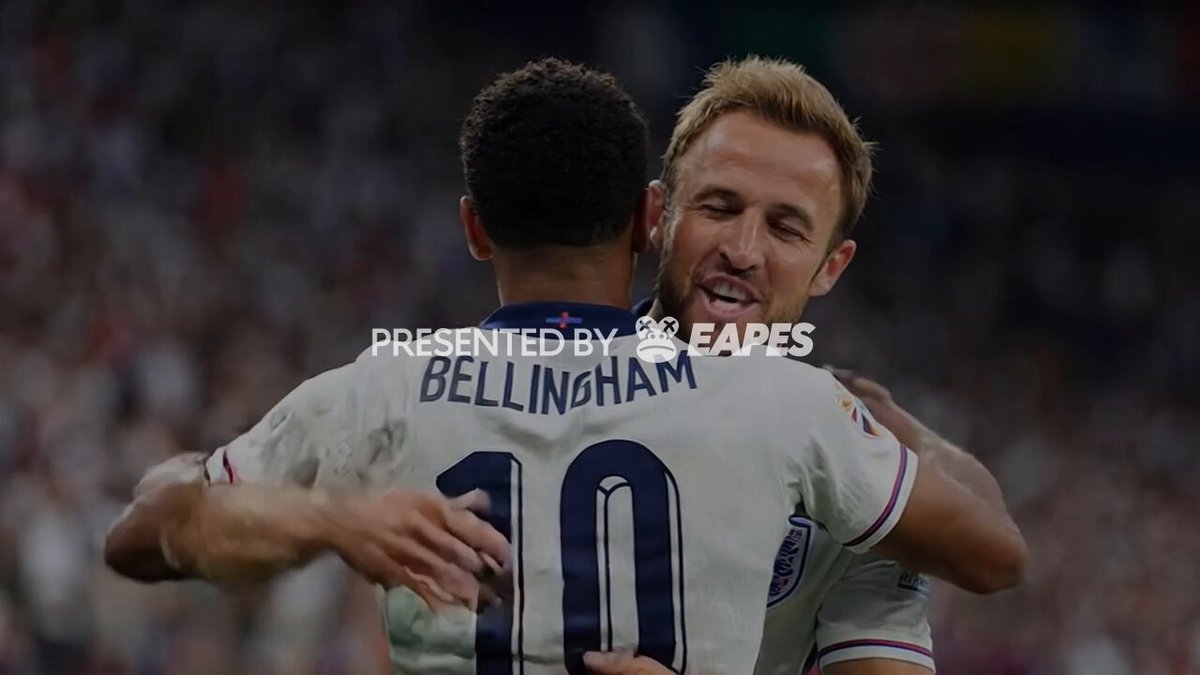 The image features two soccer players embracing each other on a field with a crowd of people watching them. The background shows a stadium filled with spectators, indicating that this event is taking place during an important match or tournament. The text "IT'S LIVE! EAPESPREDICT.COM" suggests that the photo was taken by a website called Eapes Predictor, which provides live updates and predictions on sports events like soccer matches.