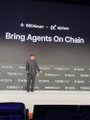 A presenter stands on a stage beneath a screen displaying '800万+ 件突破!!' and 'Bring Agents On Chain', with the zkPass logo visible at the top.