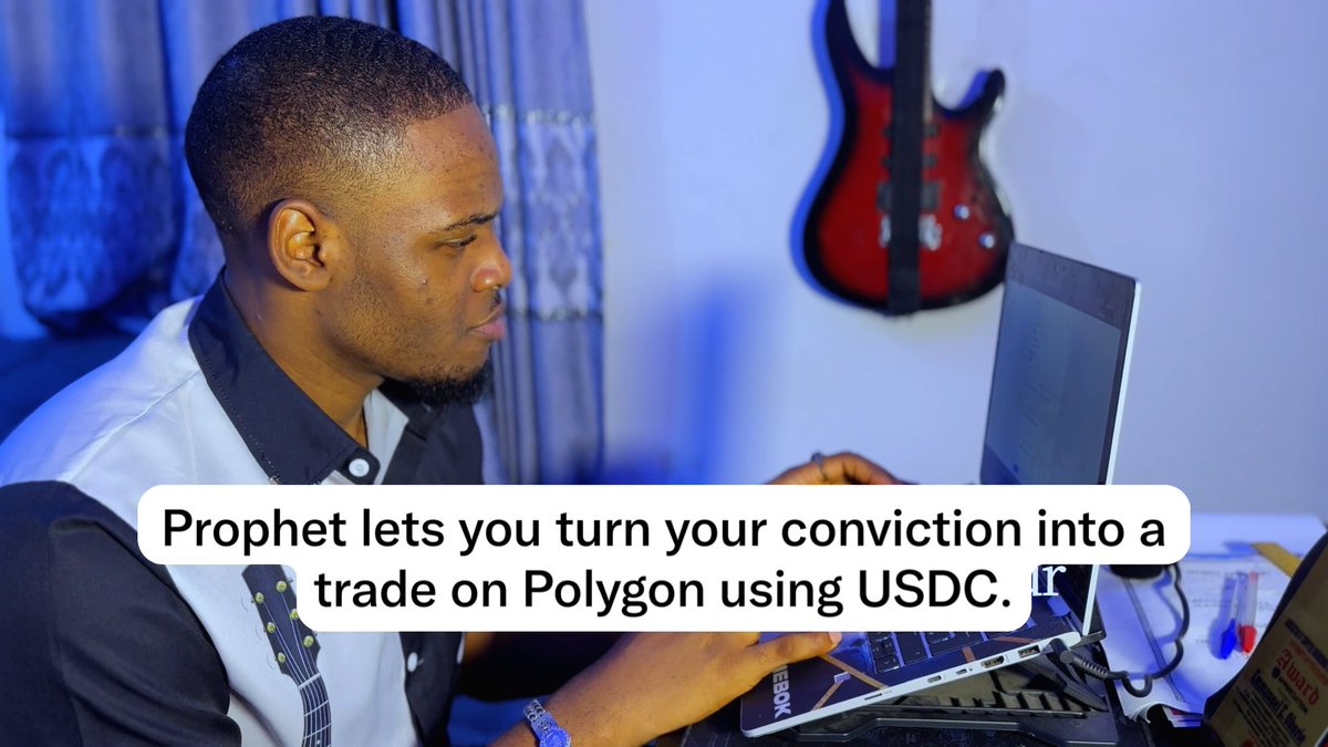 A man focuses intently on his laptop screen in a room with a guitar mounted on the wall, overlaid with the text "Prophet lets you turn your conviction into a trade on Polygon using USDC."

The image illustrates the accompanying post's idea: just as the man is doing his research, users can back their bold predictions—like Mbappé winning the 2025/26 Ballon d'Or—by creating and trading on markets via Prophet Market AI using USDC on Polygon.