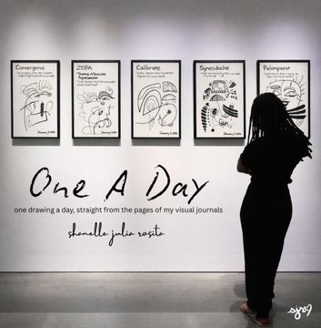A woman with dark hair viewing an art exhibition titled 'One A Day' by Danielle Julie Wootta, featuring framed line drawings from visual journals on a white gallery wall.