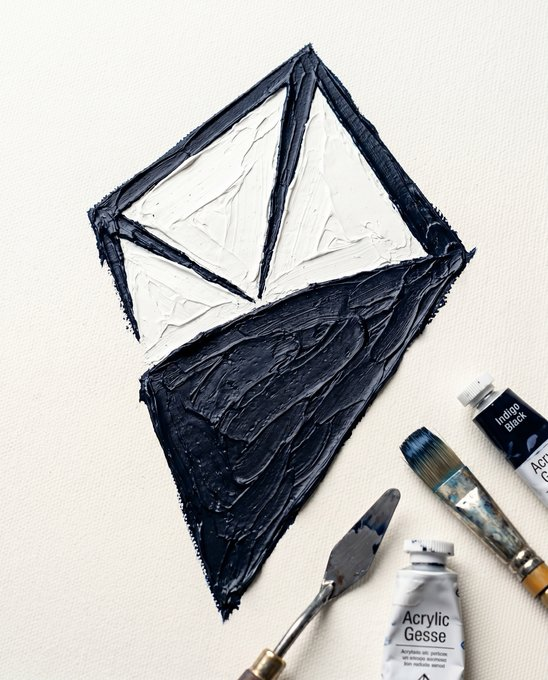 An artistic mixed-media painting depicts the Monero cryptocurrency logo (a stylized 'M') rendered in black and white with thick, textured acrylic paint, accompanied by painting tools including a palette knife, brush, and tubes labeled 'Indigo Black' and 'Acrylic Gesse'.
