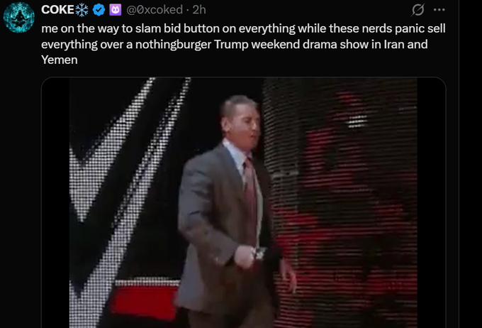 A tweet from user @0xcoked reads "me on the way to slam bid button on everything while these nerds panic sell everything over a nothingburger Trump weekend drama show in Iran and Yemen," paired with a clip of the "Costanza walk" from Seinfeld where George excitedly struts away in his suit, humorously celebrating capitalizing on the dip while others panic sell.